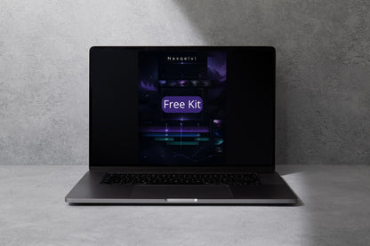 Laptop with a dark screen displaying 'Naxselvi' and 'Free Kit' on a gray surface.