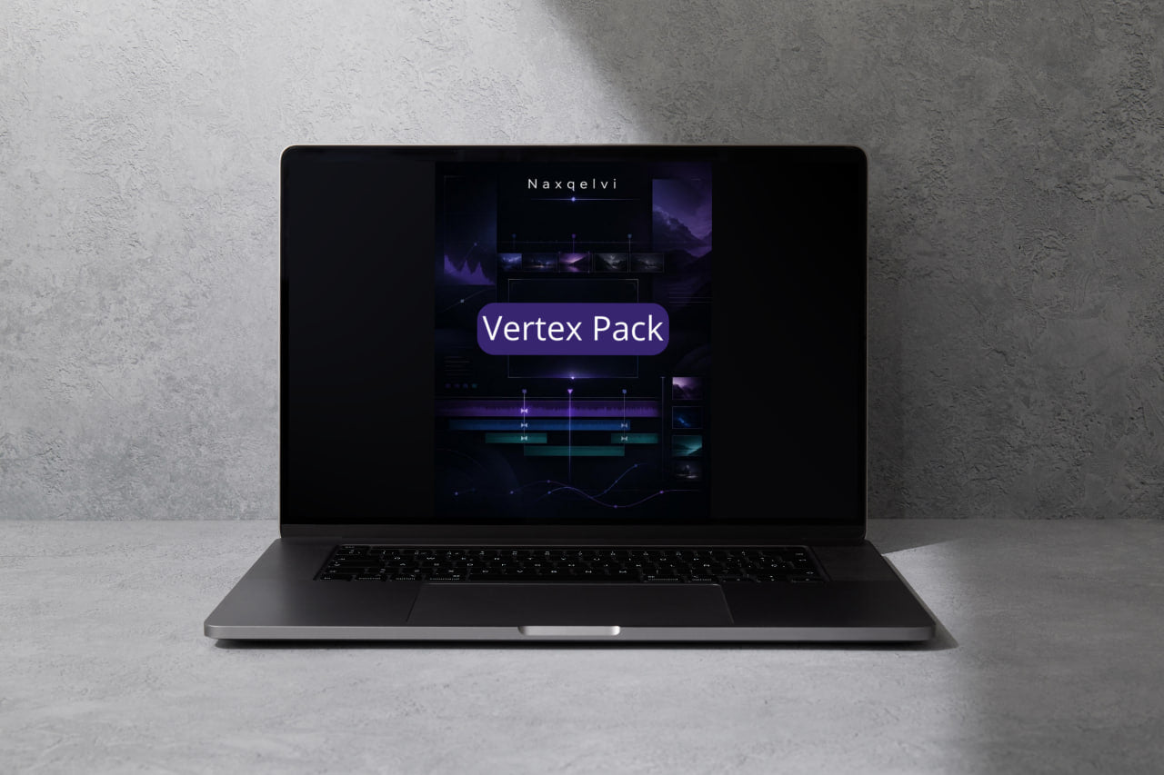 Laptop with a dark screen displaying 'Vertex Pack' on a gray surface and background